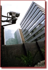 A remote control PTZ camera mounted on an office building in central London